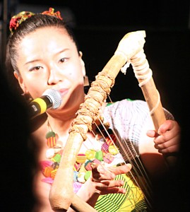 Anyango plays the nayatiti for the Berklee College of Music audience.
